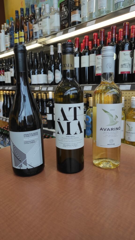 Three bottle of wines on a table top
